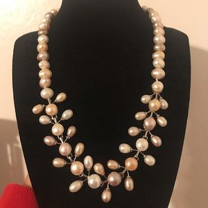 Matching pearl necklace, bracelet, and earrings